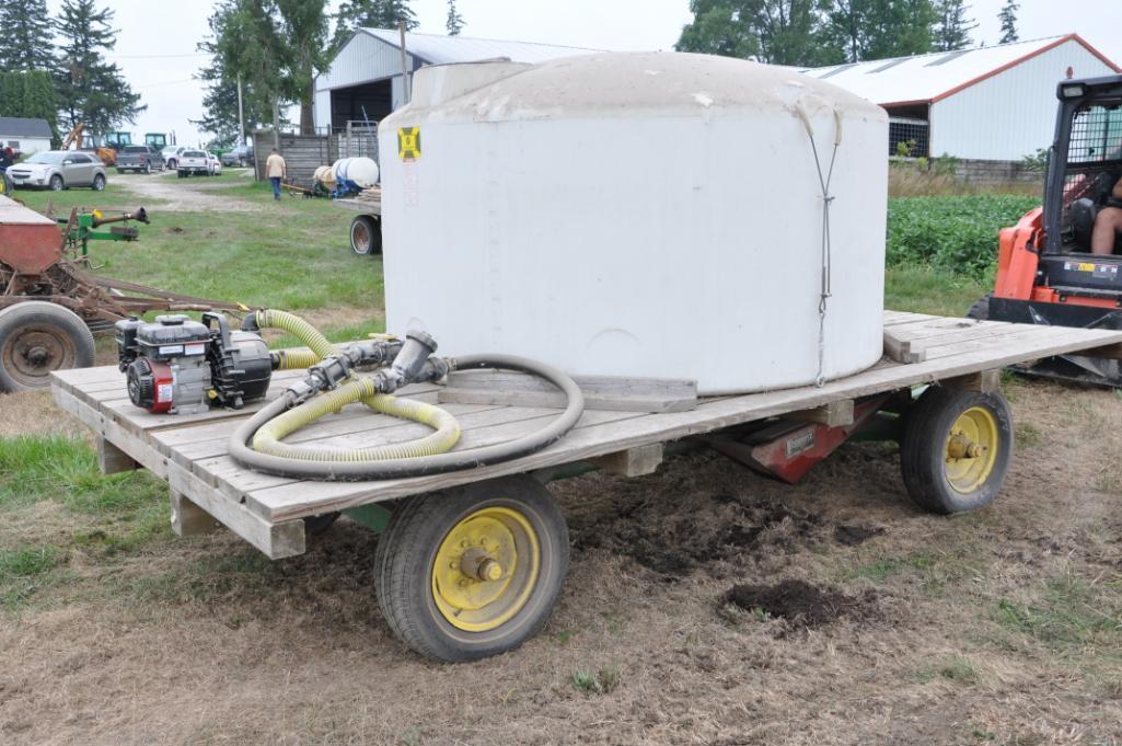 14' wooden hayrack on JD running gear w/tank & pump