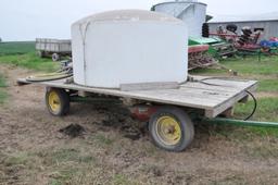 14' wooden hayrack on JD running gear w/tank & pump