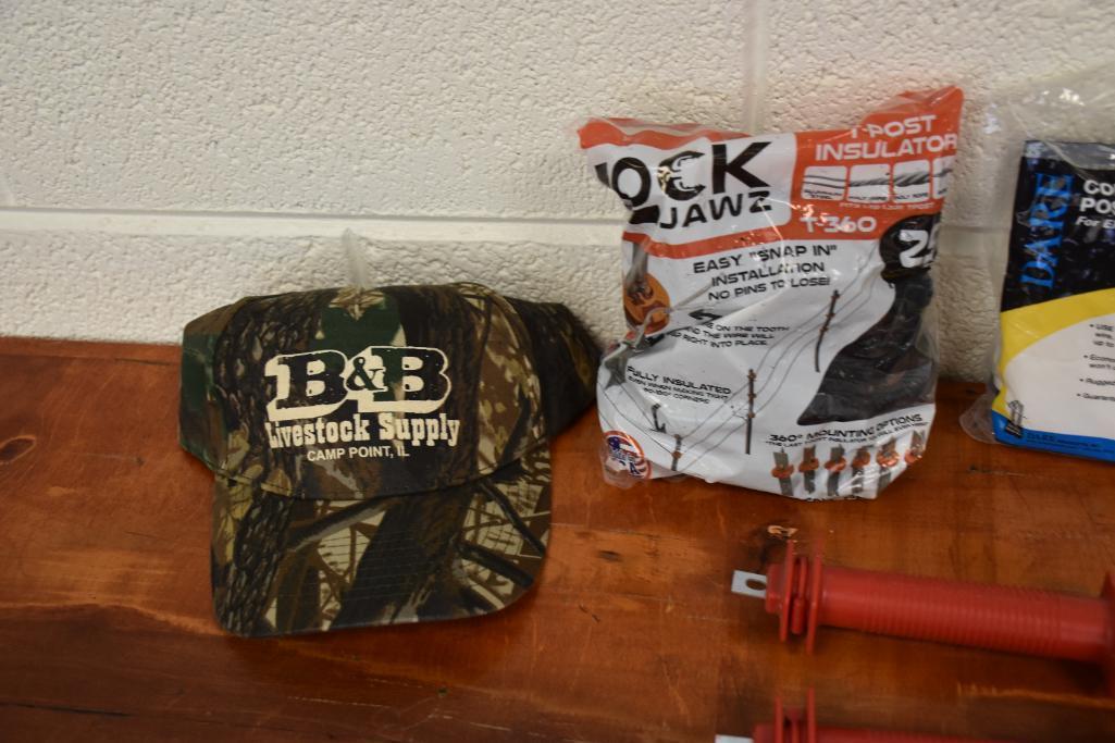 Hot wire fencing equipment and B&B Livestock Supply hats