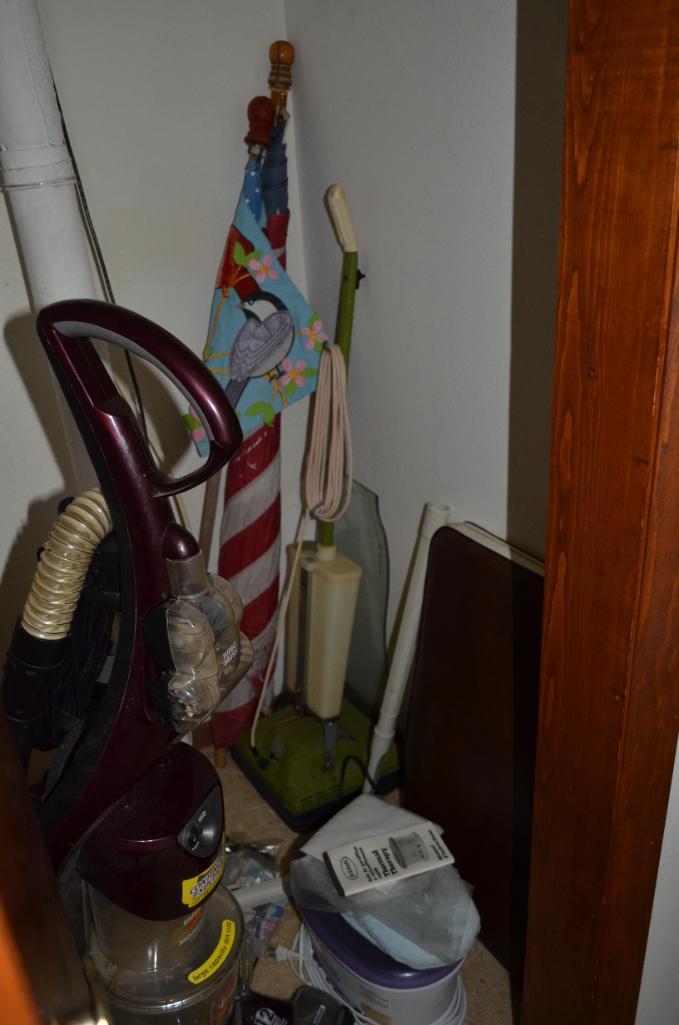 Contents of closet, vacuum, flag, etc.