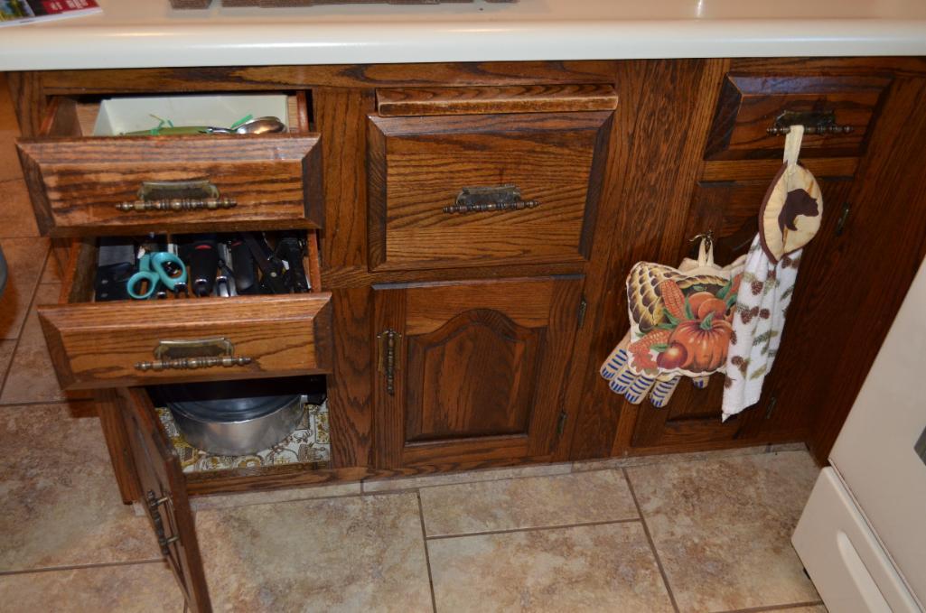 Contents in all kitchen cupboards to include: Kenmore microwave, toaster, Franciscanware, water