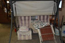 2-seat glider w/ canopy (upholstery is torn), also selling red wood folding chair, leaf rakes, limb