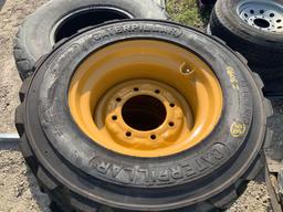 4 Caterpillar 10-16.5 Skid Steer Tires w/wheels