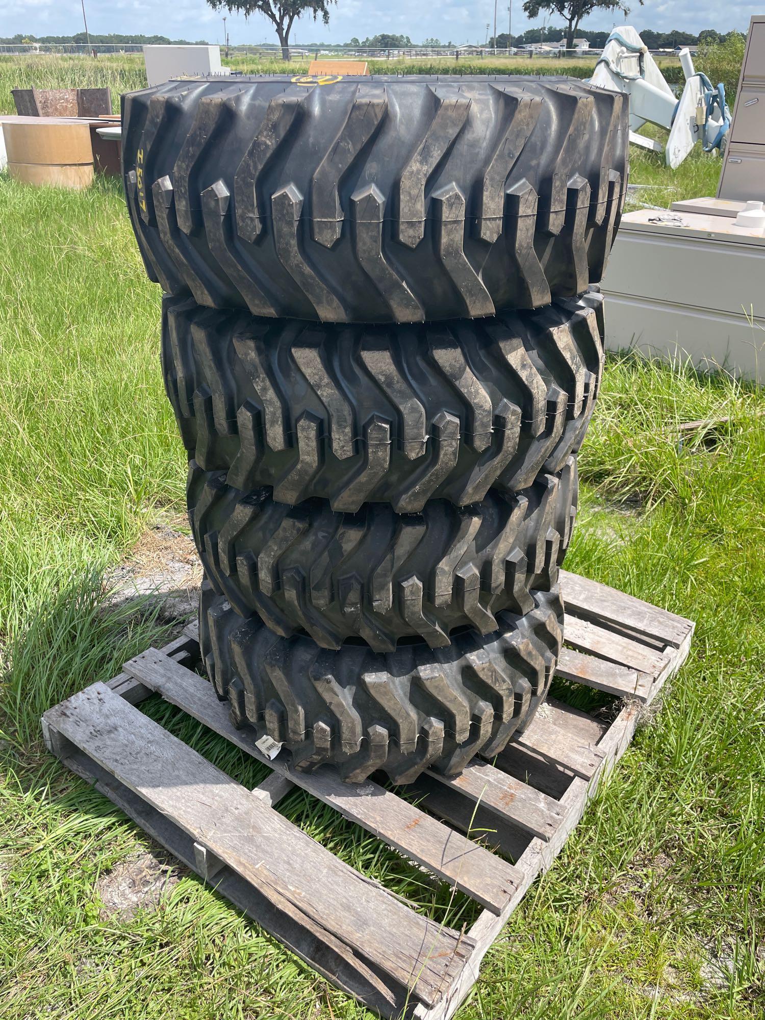 Four Unused Camso 12-16.5 Skid Steer Tires and Wheels