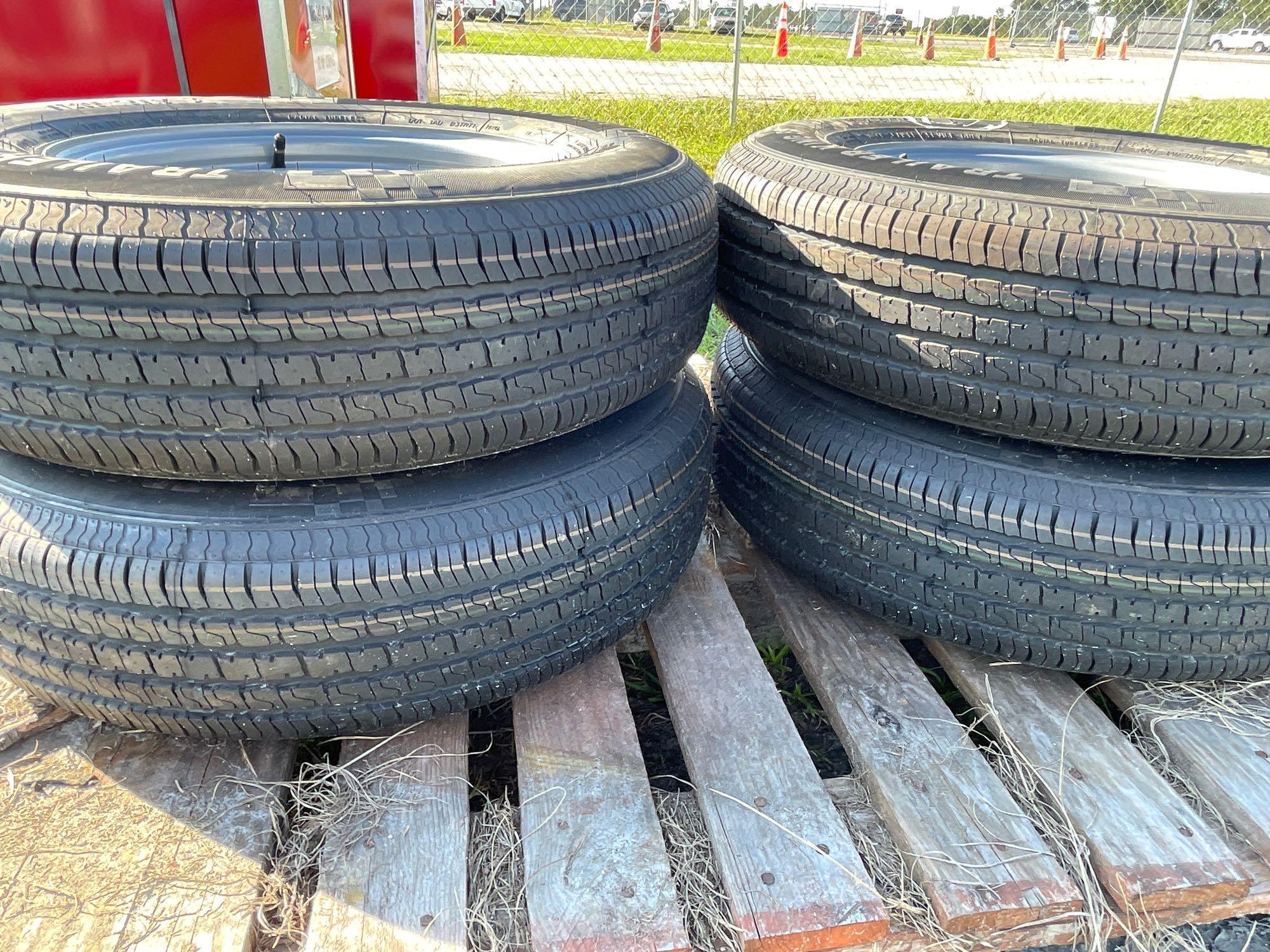 Four Unused 205/75R15 Trailer Tires and Wheels