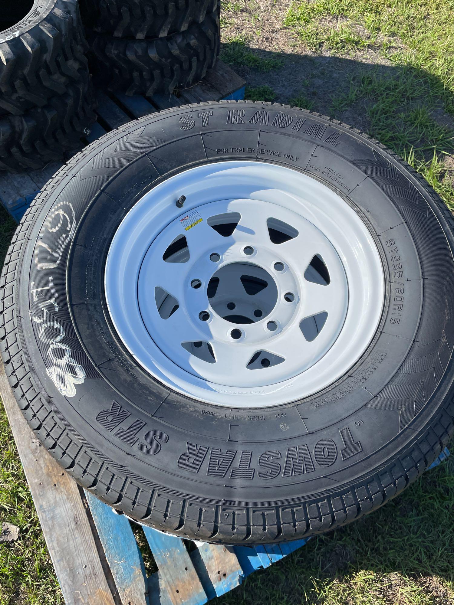 Four Unused ST235/80R16 Trailer Tires and Wheels