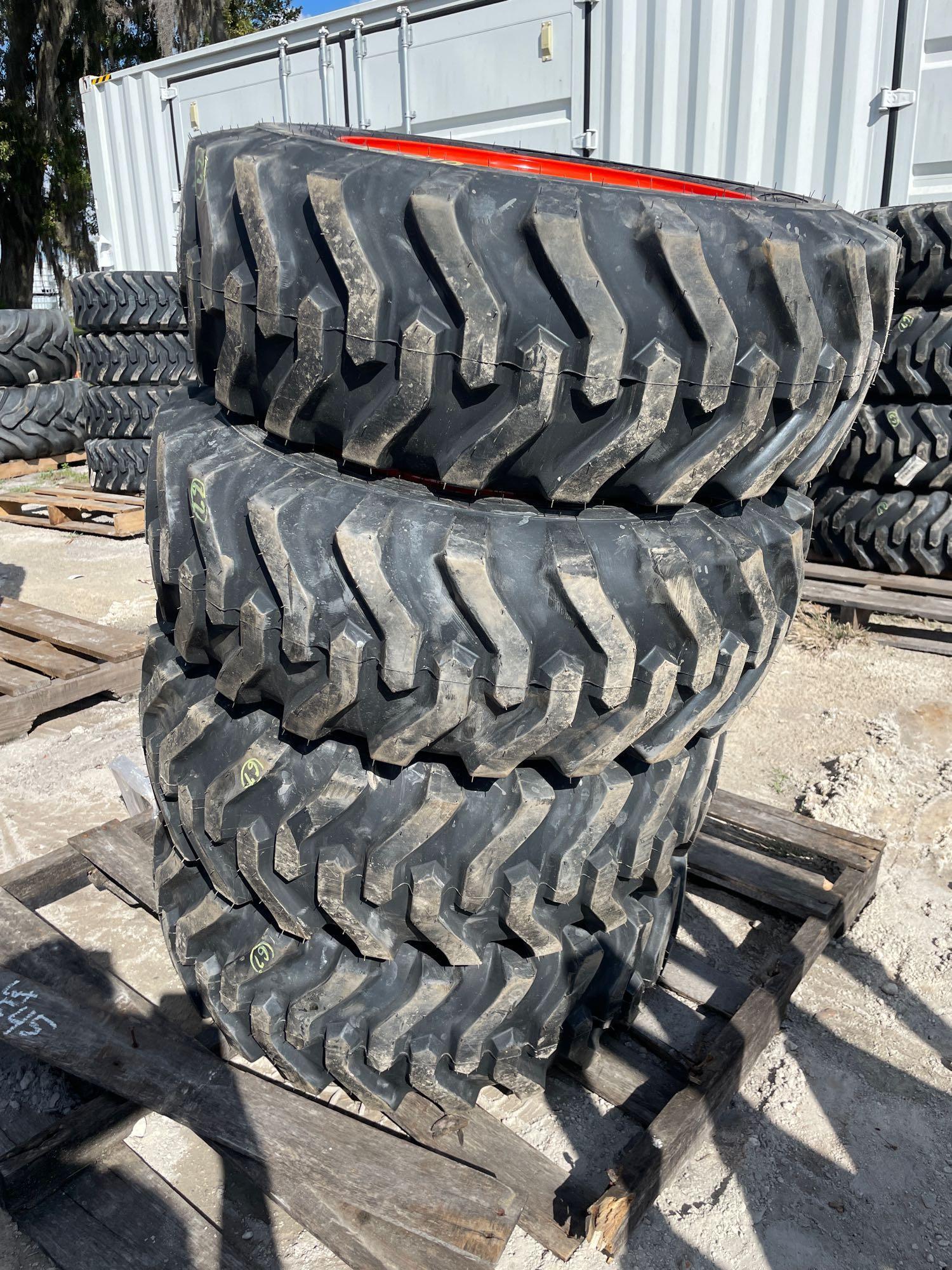 Four Unused 10-16.5 Skid Steer Wheels and Tires