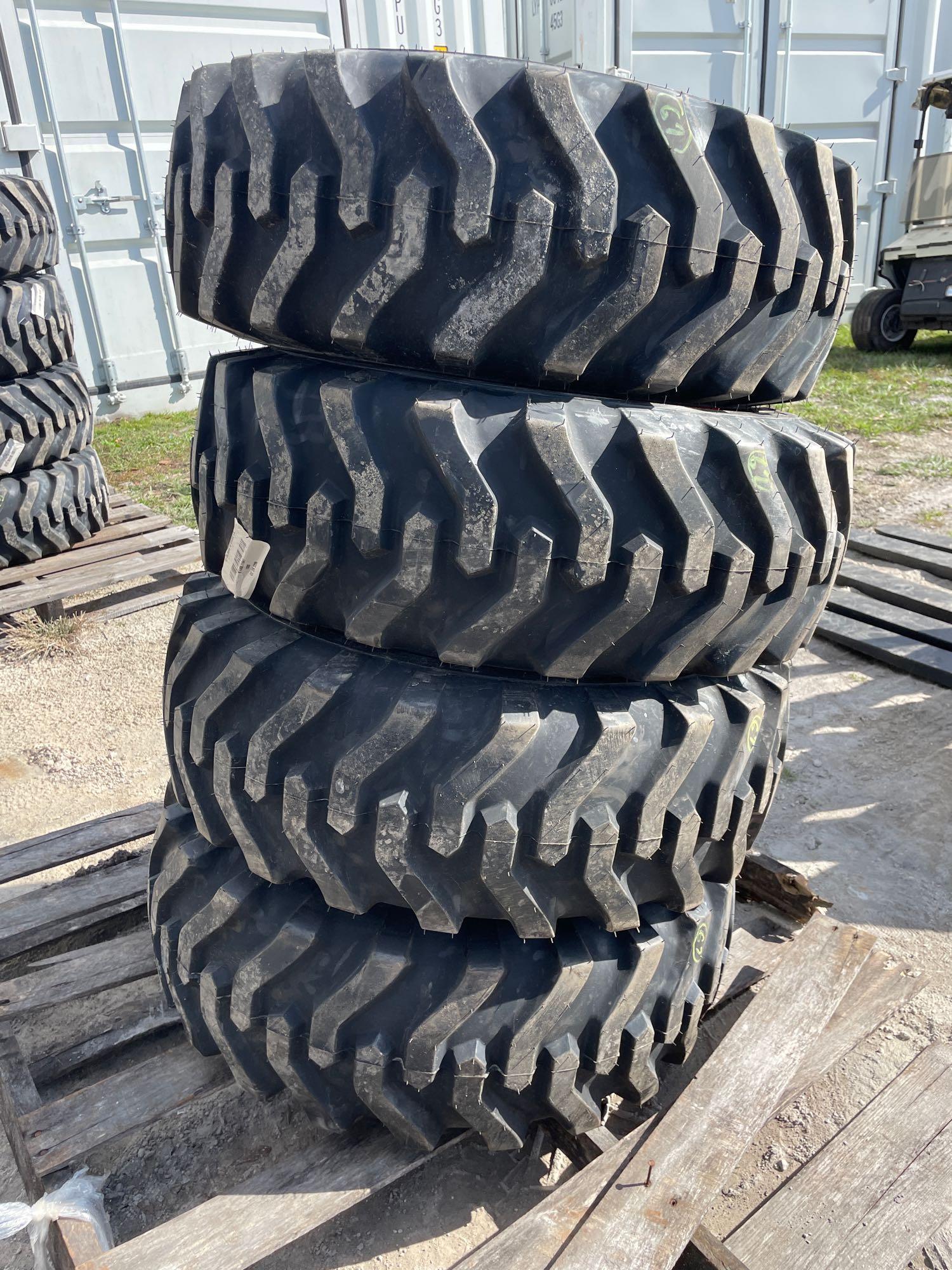 Four Unused 10-16.5 Skid Steer Wheels and Tires