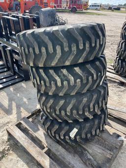 Four Unused 10-16.5 Skid Steer Wheels and Tires