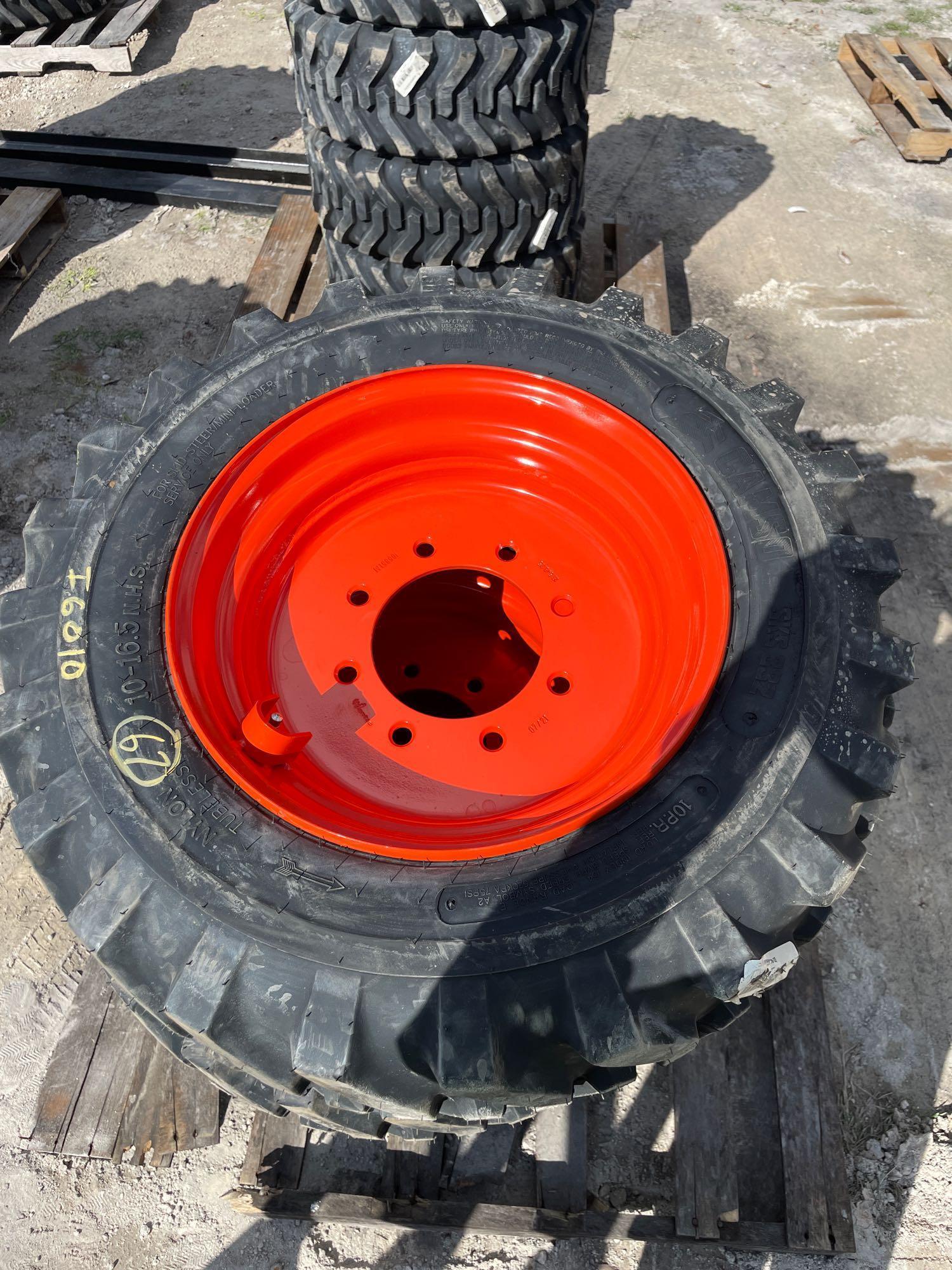 Four Unused 10-16.5 Skid Steer Wheels and Tires