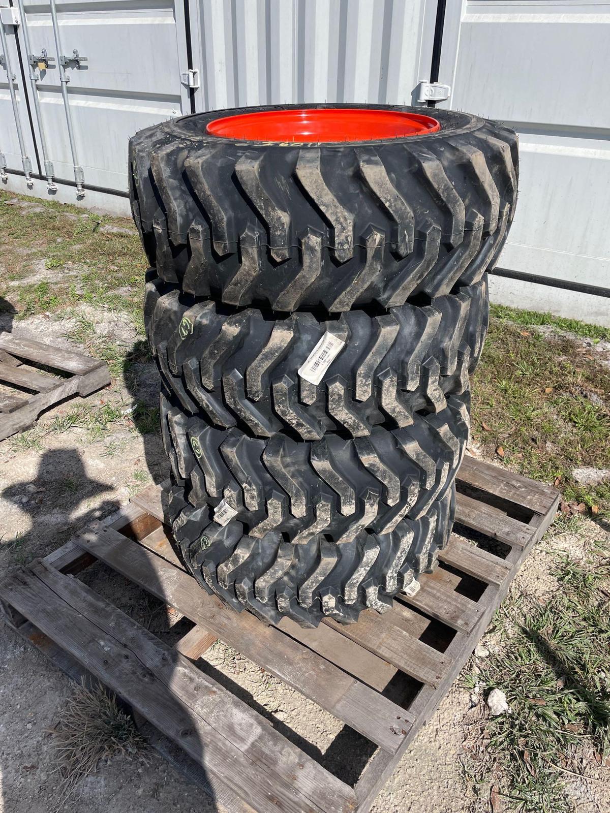 Four Unused 10-16.5 Skid Steer Wheels and Tires