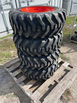 Four Unused 10-16.5 Skid Steer Wheels and Tires