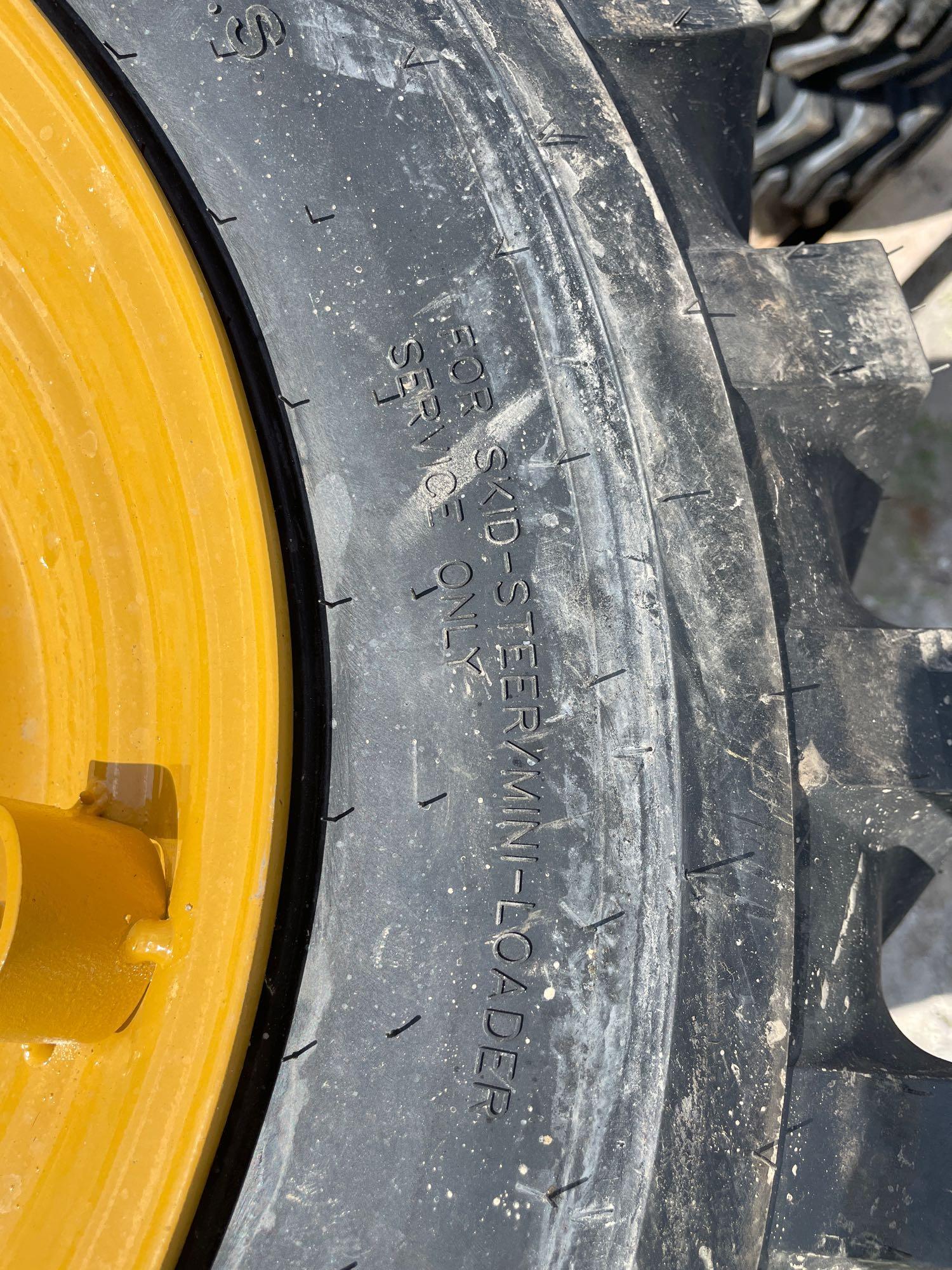 Four Unused 12-16.5 Skid Steer Wheels and Tires