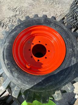 Four Unused 12-16.5 Skid Steer Wheels and Tires