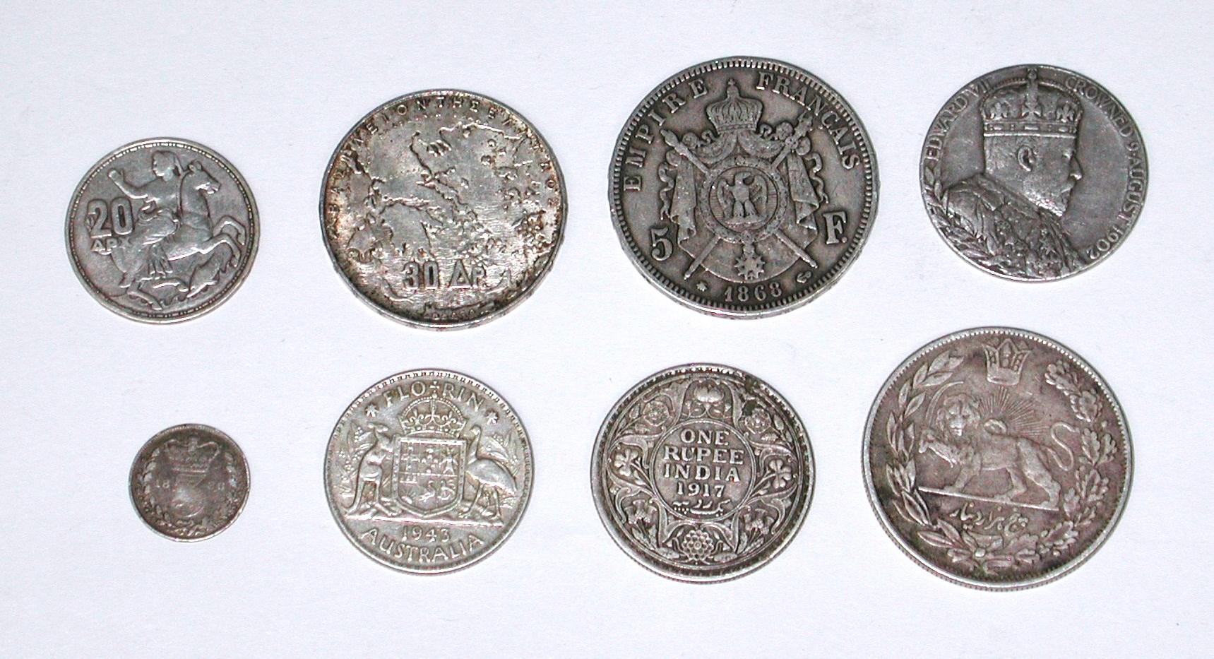 EIGHT (8) SILVER WORLD COINS