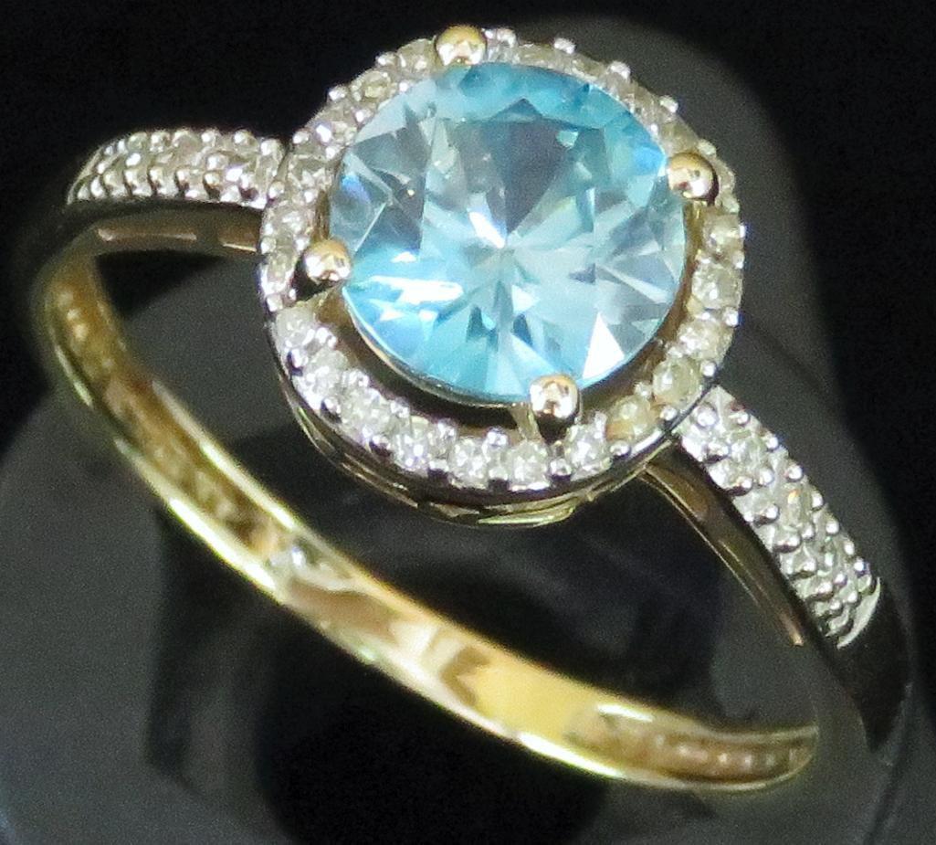 Ring tests 14K with blue & clear stones. Approx 2.6 grams.