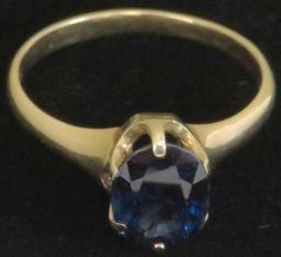 Ring tests 14K with blue stone. Approx 3.1 grams.