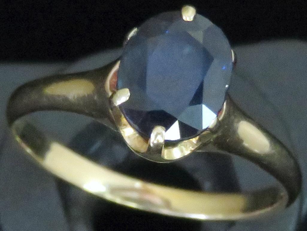 Ring tests 14K with blue stone. Approx 3.1 grams.