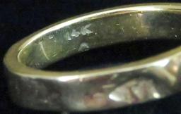 Ring marked 14K with clear stone. Approx 4.2 grams.