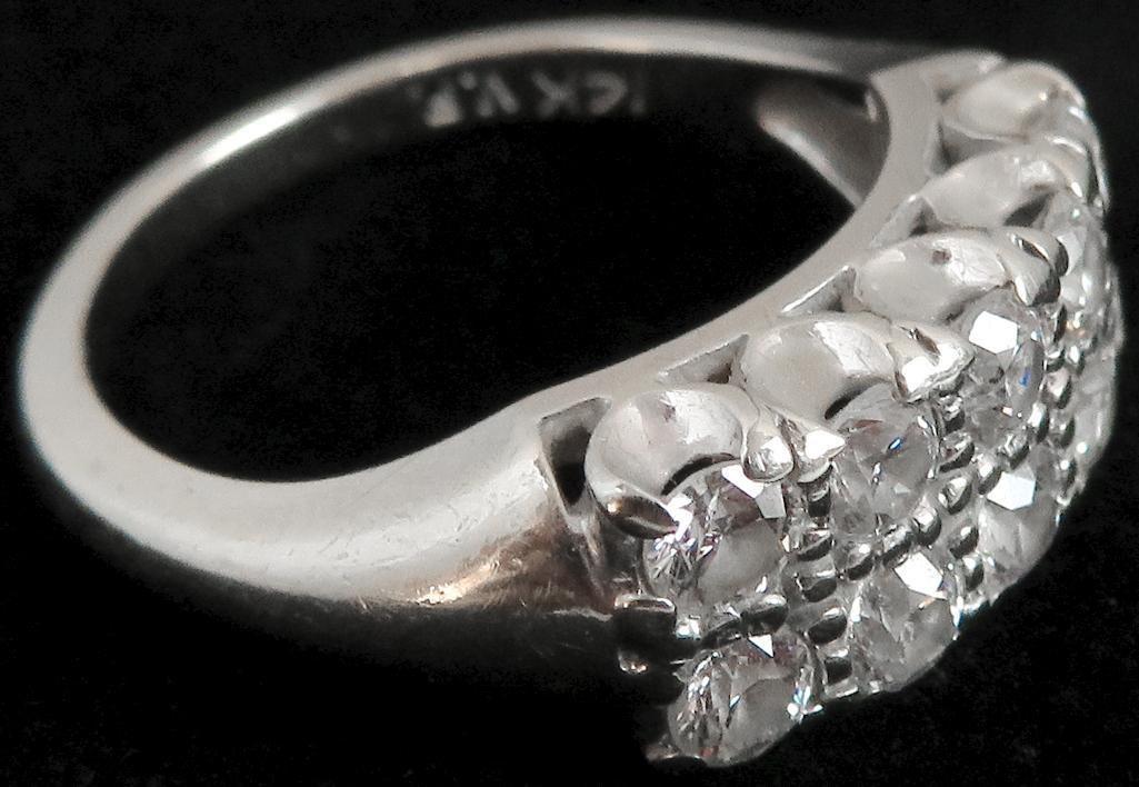 Ring marked 14K with (10) diamonds. Approx 4.0 grams.