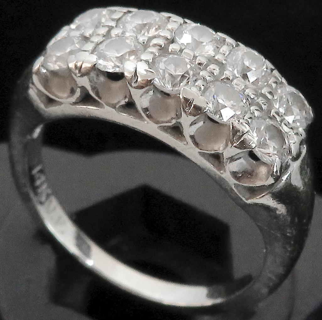 Ring marked 14K with (10) diamonds. Approx 4.0 grams.