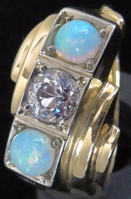 Ring marked 14K with (2) Opals & Diamond. Approx 9.2 grams.