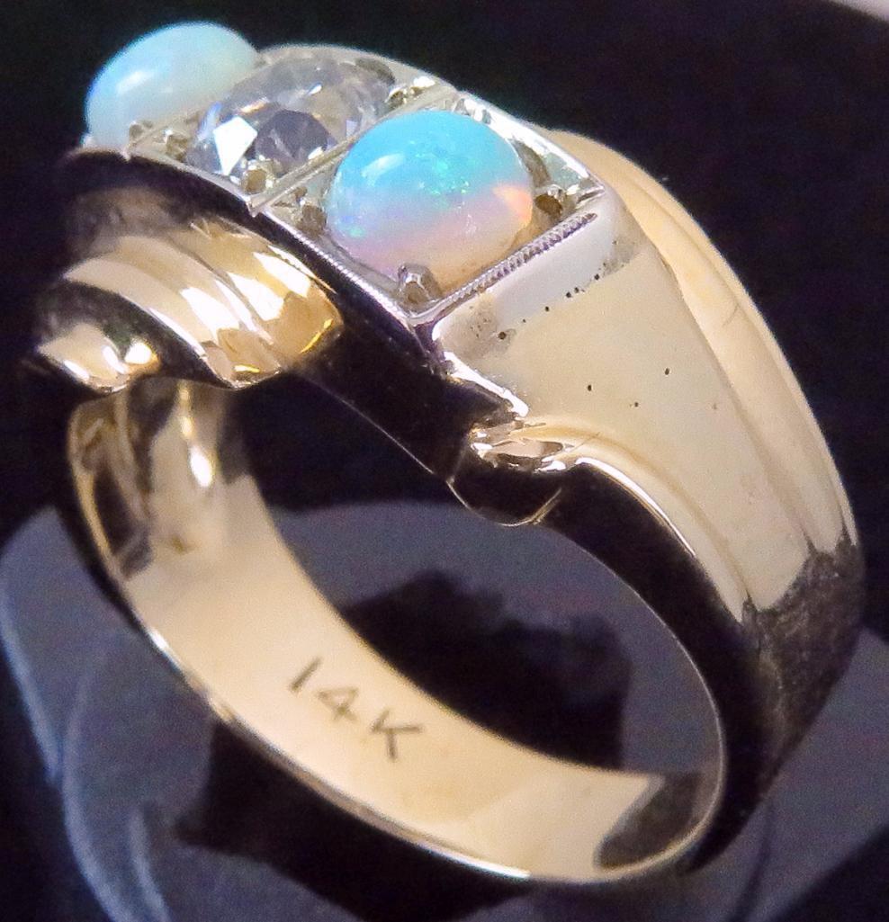 Ring marked 14K with (2) Opals & Diamond. Approx 9.2 grams.