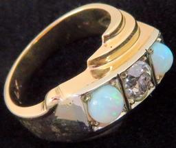 Ring marked 14K with (2) Opals & Diamond. Approx 9.2 grams.