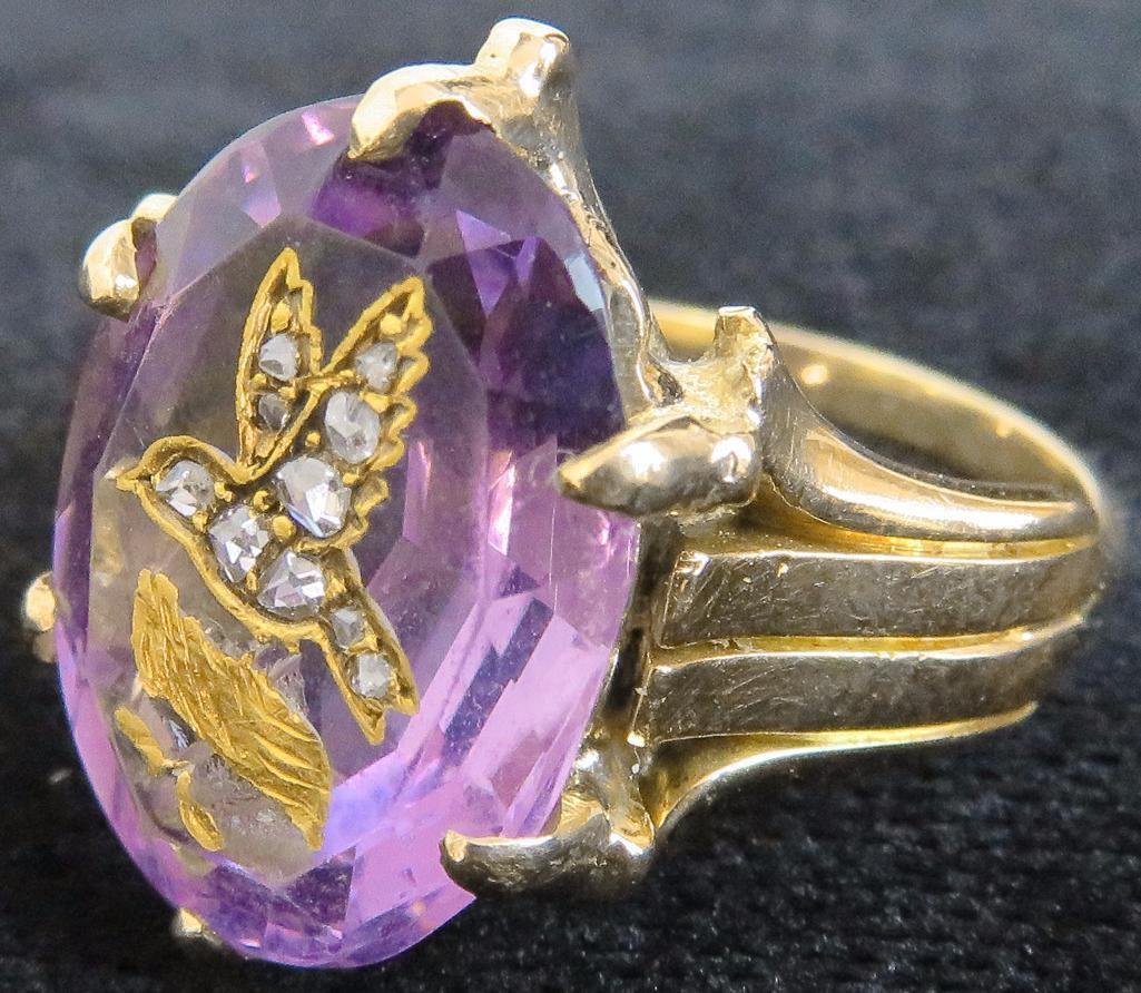 14K Ring with Oval Amethyst approx 4ct. with carved bird inlaid with (10) diamond chips. Approx 8.0