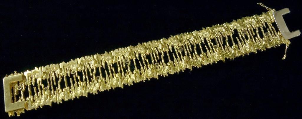 Lady's 22K Yellow Gold Diamond Bracelet. The clasp is a hidden style and is 18K White Gold. Bracelet