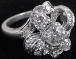 Lady's 14K white gold Ring with (17) diamonds.