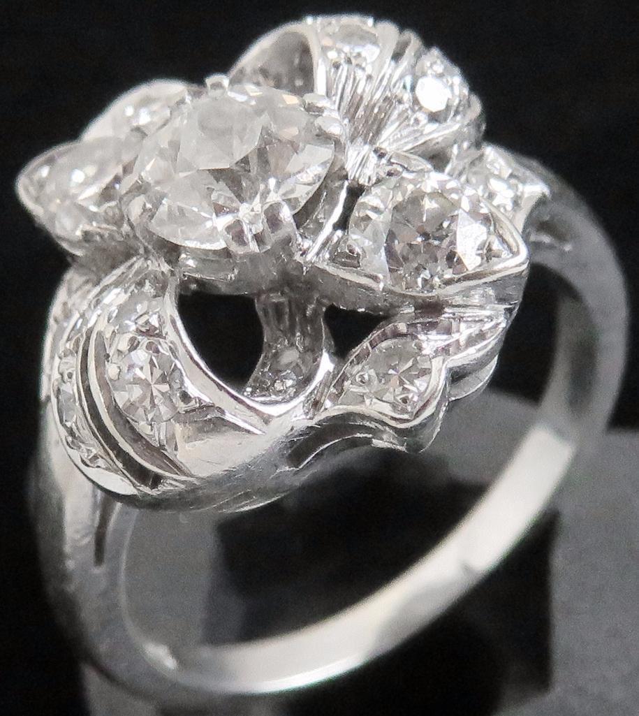 Lady's 14K white gold Ring with (17) diamonds.