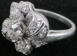 Lady's 14K white gold Ring with (17) diamonds.