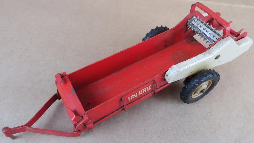 Over a dozen vintage Tru Scale Farm Equipment Toys. Som missing parts. Nice variety!