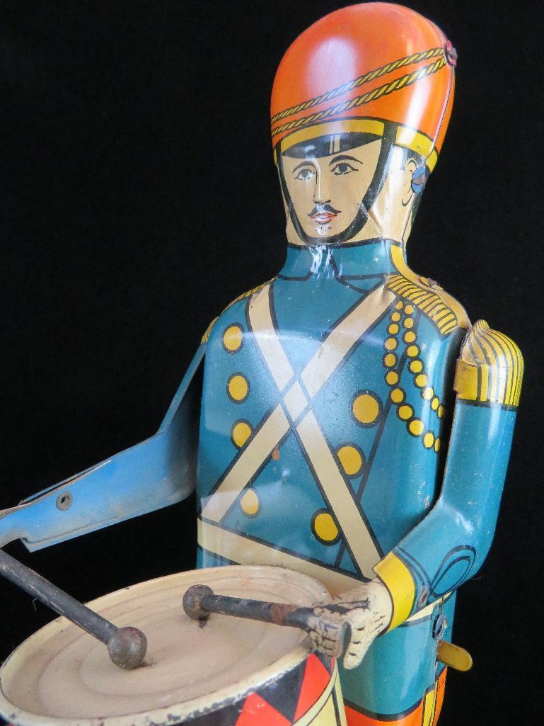 Wolverine Supply & Mfg. Tin Litho No. 27 "Drum Major". approx 13".