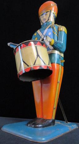 Wolverine Supply & Mfg. Tin Litho No. 27 "Drum Major". approx 13".