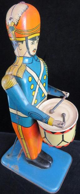 Wolverine Supply & Mfg. Tin Litho No. 27 "Drum Major". approx 13".