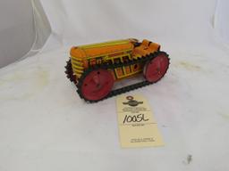 Pressed Tin Friction Tractor toy on tracks