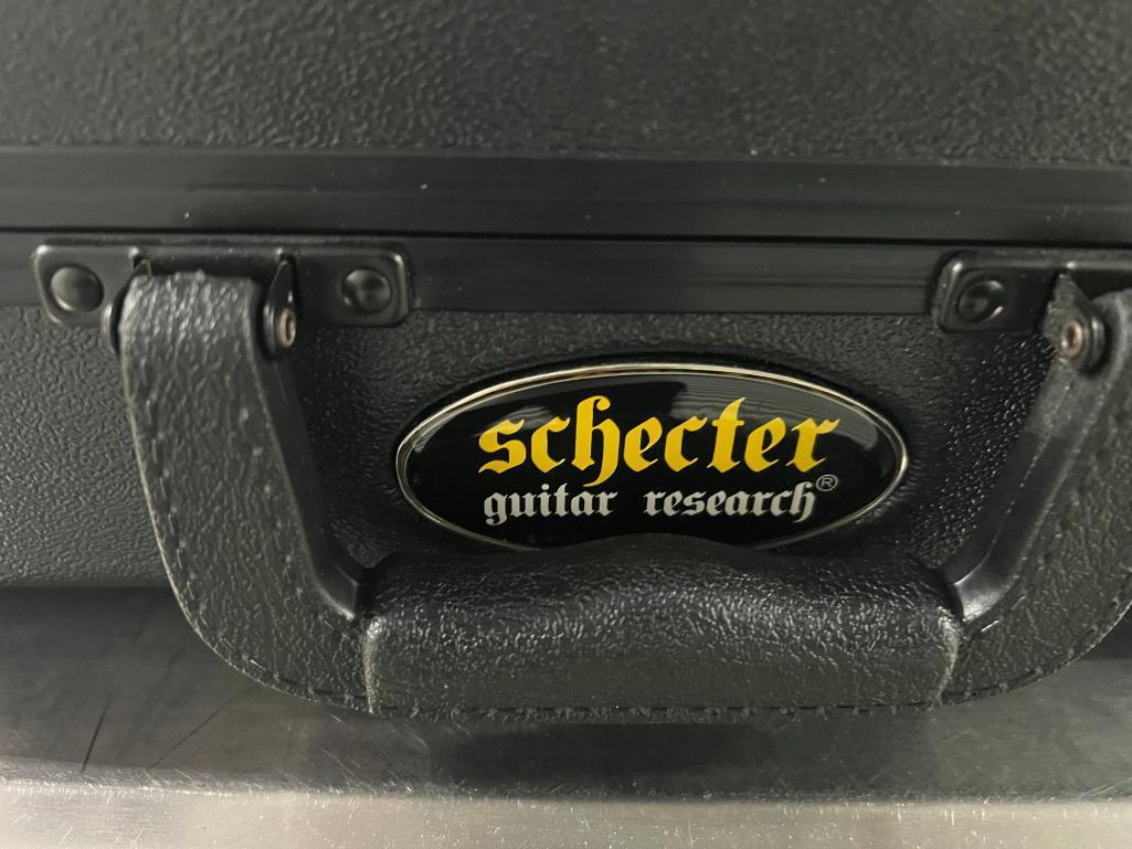 Ibanez RGIX6PDLB IP-01 electric guitar (s/n I17124866) in Schecter Guitar Research hard case.