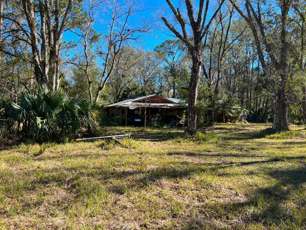 4 bed 2 bath, 1,843sf brick home with metal roof