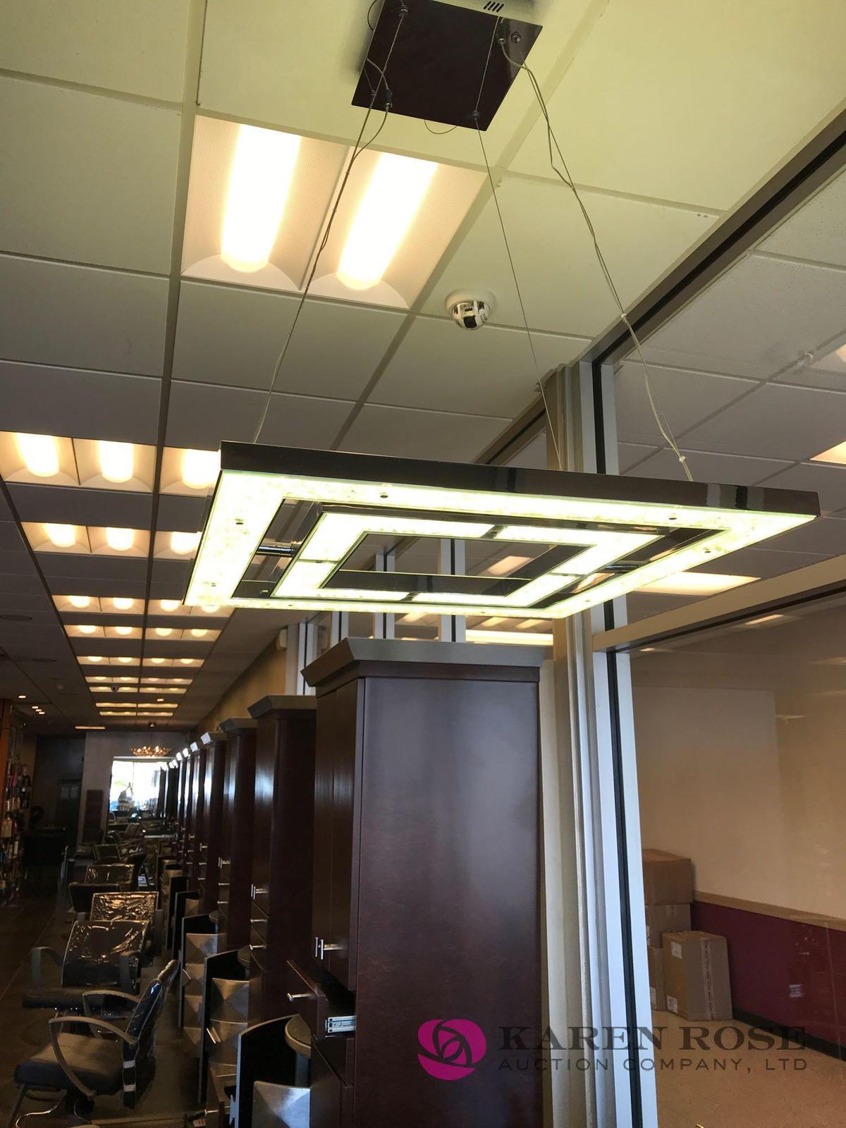 Modern chandelier has been taken down by electrician