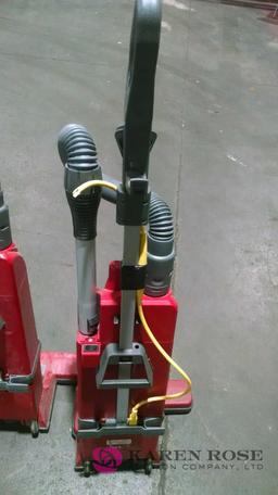 Three sanitaire commercial dual motor vacuums