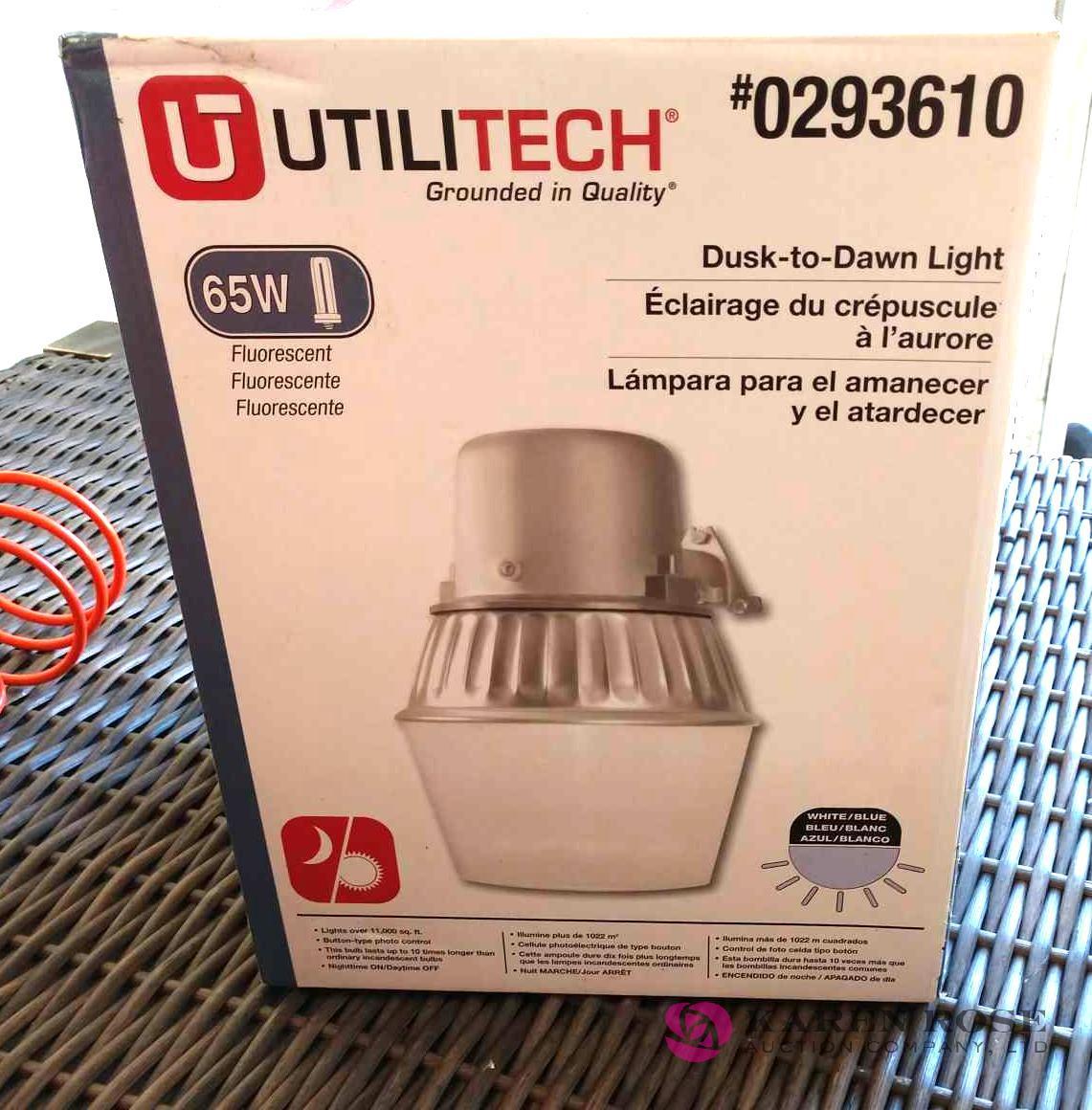 Dusk to Dawn utility light in box