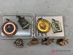 Assorted charms and awards