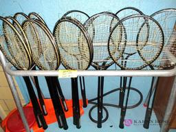 Lot of badminton rackets and nets
