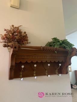 Wooden coat rack and artificial flowers