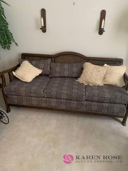 Cane back sofa with cushions