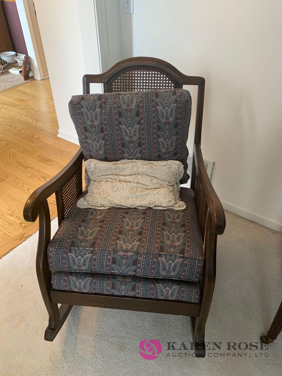 Cane back rocking chair with cushions