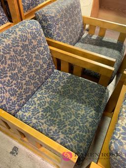 Four matching wooden chairs with cushions