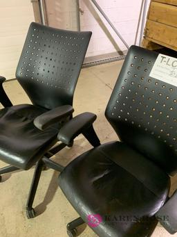 Two matching black computer chairs